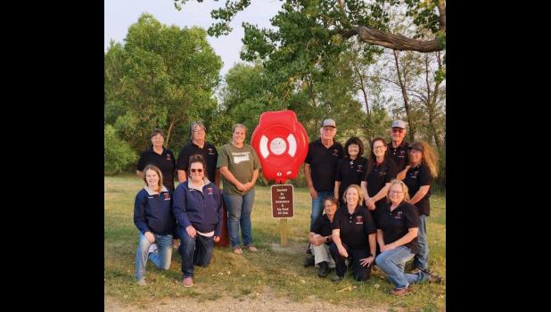 Faith Ambulance Service ... pictured with Top Hand 4-H Advisor Kim Bachman at Durkee Lake. Back row: Tracie Henderson, Kristi Medrud, 4-H Advisor Kim Bachman, Mayor Glen Haines, Lila Fisher, Holly Spencer, Robert Fisher, and Jana Johnson. Front row: Lenae Hulm, Brittany Brooks, Carmen Fees, Katrina Collins, and Ambulance Director Kris Escott. Photo Courtesy Kris Escott