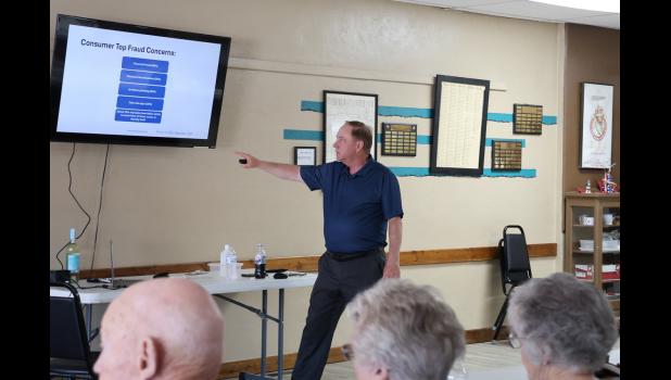 John McCullough, from Financial & Retailers Protection Association (FRPA) walks through a powerpoint, Fraud Fighting ToolBox for Consumers, during the Fraud Awareness Event sponsored by First National Bank.