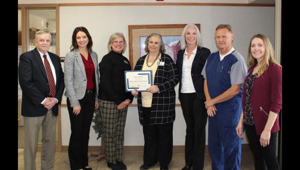 Pictured are, left to right, James Keegan, MD, Randee Mason, RN, Lori Koenecke, RN, Maureen Cadwell, Philip Health Services, CEO, Melissa Magstadt, Secretary of the DOH, David Holman, MD, Chief of Staff at PHS, and Beth Dokken, DOH. Courtesy photo