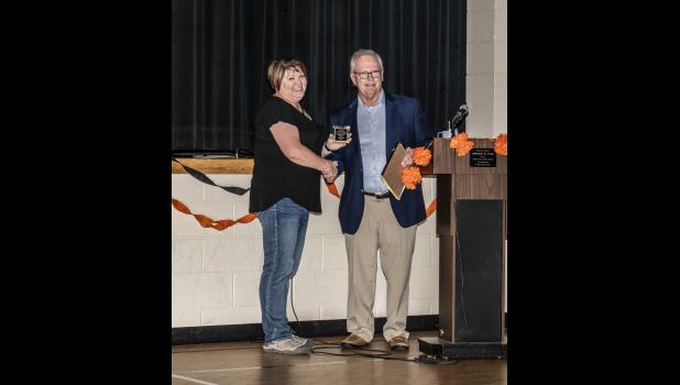 Philip High School Alumni Association board member Kim Kochesberger presents Doctor Douglas O’Dea with a plaque as he is inducted into the PHS Hall of Fame. Deb Smith Photography