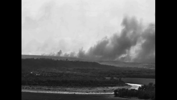Smoke billows pushed by strong winds. Southwest of the Thomas ranch, 12 miles south of Murdo. Photo by Krisanna Thomas