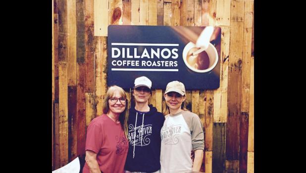Kerry Burns, Jenny Terkildsen and Trisha Larson pose at the Dillanos Roasters trade show booth. The company helped the three co-owners of ginneys coffee shop get started in the coffee business, including creating the Bad River Coffee Company logo and supplying the coffee.