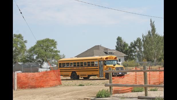 The eastern portion of the playground is cordoned off for parking.