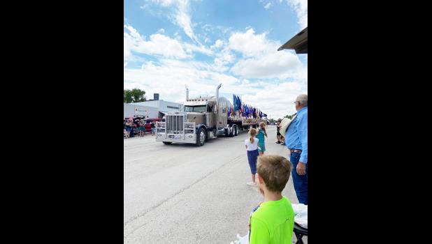 Magelky Trucking carrying all the Flags. Jo Johnston