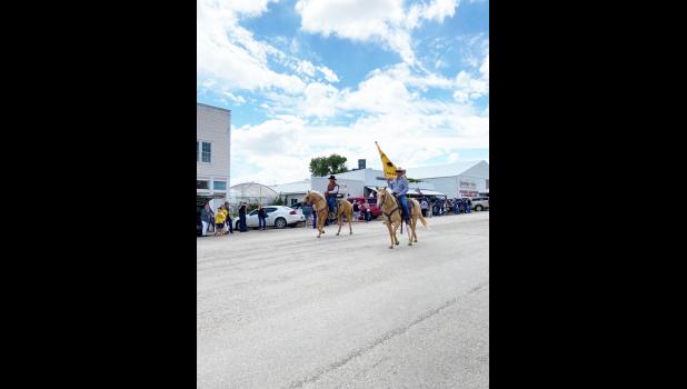 Veryl Prokop and Jamie Willert, holding the Kadoka Buffalo Stampede Flag. Jo Johnston
