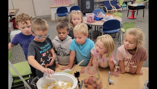 Brace Beer, Rhett Schmidt, Terek Keller, Krisee Veal, Evan Carmichael, Brooklyn Card, Teagan Keller making applesauce.