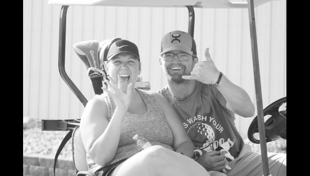 Beth White Buffalo and Tanner Prince are ready to get their golf on. Photo by Mishayla Buchannan