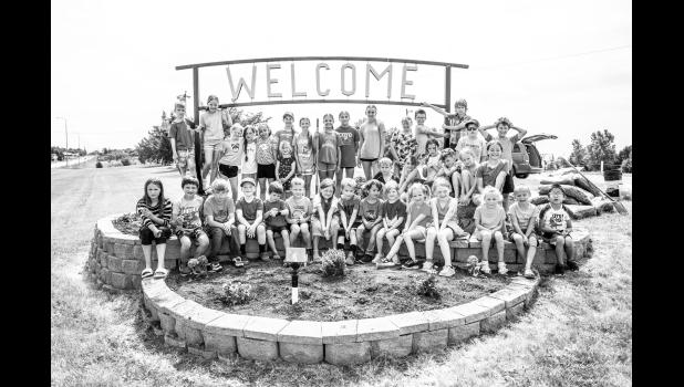 Coyote Club youth helped with the planting as a community service project. They also picked up garbage around the park as a community clean up effort. Photo by Barb Hockenbary Photography