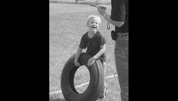 Klay Kinsley is excited for his turn in the tire throwing competition Photo by Mishayla Buchannan