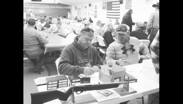 Kevin Moore had flasks with lucky numbers to win a hunting gun. Steven O’Dell held sign ups for a heads or tails game with glow sticks.