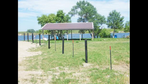 The North Dam picnic shelter with the fence poles.