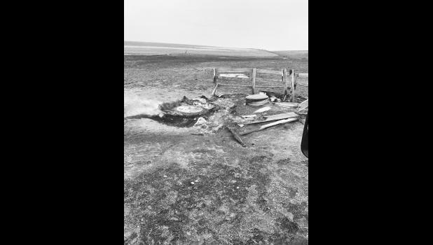 A tire tank with concrete in the bottom. Next to it is a culvert used as an underground pump house. Photo courtesy Brandon Kinsley