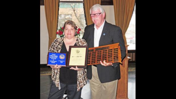 Jo Manke-Rodgers receives Postmaster of the Year Award presented by Steve Lenoir, theVice President of South Dakota's National League of Postmasters.