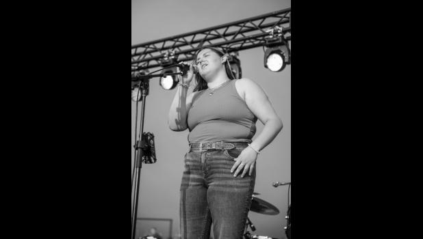Emmy Newsam sings at the concert on Saturday night. Photo by Barb Hockenbary Photography