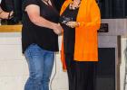 Kim Kochesberger presents Brigitte Brucklacher with a plaque representing her induction in the the PHS Alumni Hall of Fame during the Homecoming Coronation on Tuesday, September 2. Deb Smith Photography
