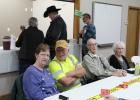 Rick and Rhonda Coyle sit at the guest table along with former Mayor Mike West and others at the Open House honoring Coyle for 45 years of service to the community.