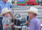 Philip Chamber of Commerce “Professional Announcers” Glenn Parsons and Doug West were on hand at the mechanical bull riding to give encouragement and interview a few contestants. Here Doug West looks into the eyes of contestant Wyatt Addison, Milesville, SD cowboy and visits about riding style, the bull he drew, and if he was healthy enough to get on his re-ride. Wyatt and many others had a number of rides on the bull that was on main street Friday evening.