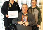 Mindy Smith (pictured far left) earned Healthcare Hero from the South Dakota Association of Healthcare. Here she is pictured with her father Tom and mother Marie. Courtesy photo